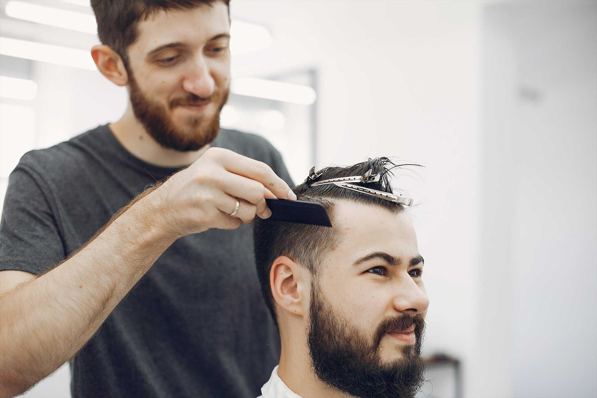 stylish-man-sitting-in-a-barbershop-2023-11-27-05-07-45-utc