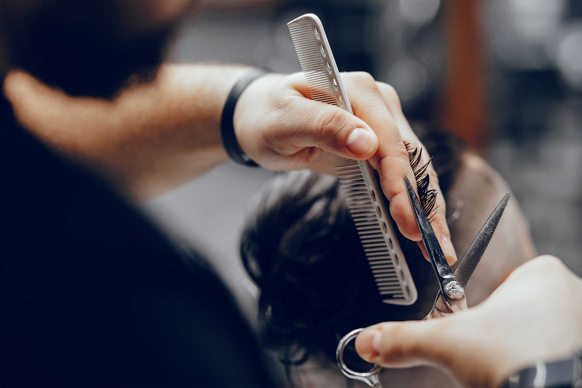 stylish-man-sitting-in-a-barbershop-2023-11-27-05-30-10-utc